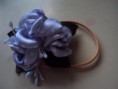 /album/amarradores-de-cabelo/amarrador-lilas-com-poa-jpg/